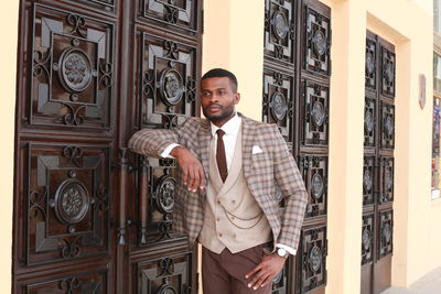 Businessman standing outside building