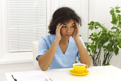 Young woman using laptop at home