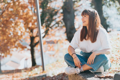 Young woman sitting on chair