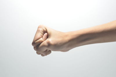 Close-up of human hand against white background