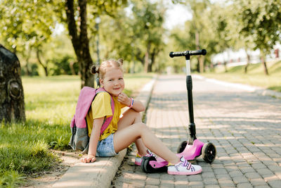 Portrait of young woman exercising in park