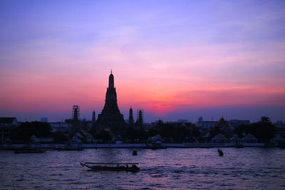 Silhouette of temple against sky during sunset