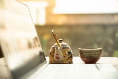 Close-up of coffee cup on table