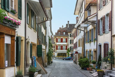 Street amidst buildings against sky