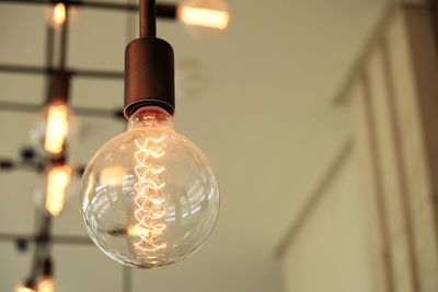 Low angle view of illuminated light bulb