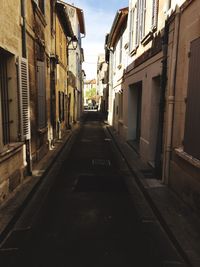 Narrow alley along buildings