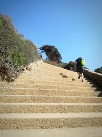 Low angle view of people walking on steps