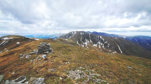 Scenic view of snowcapped mountains against sky