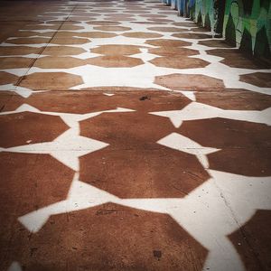 High angle view of shadow on footpath