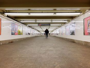 Couple walking in subway station in nyc 