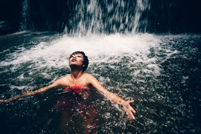 Portrait of shirtless man in water