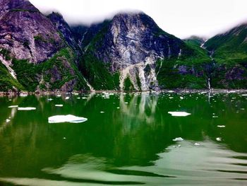 Scenic view of lake with mountains in background