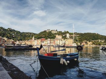 Boats moored at harbor