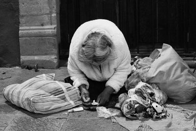 People sleeping on street in city