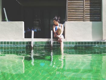 Full length of woman in swimming pool