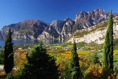 Scenic view of mountains and trees against clear sky