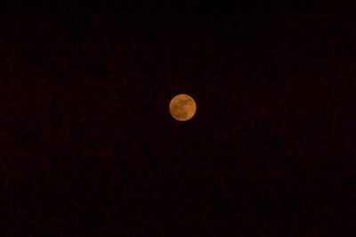 Low angle view of moon against sky at night