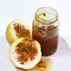 Close-up of juice in glass jar on table