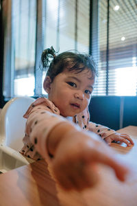 Portrait of cute baby at home