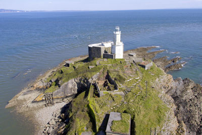 High angle view of rock on beach against sky