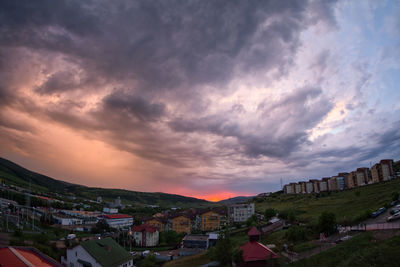 High angle shot of townscape against sky at sunset