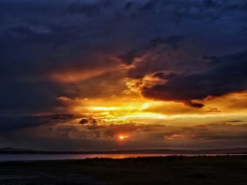 Scenic view of sea against cloudy sky