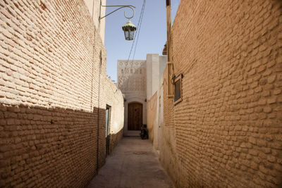 Narrow alley amidst buildings in city