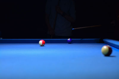 Man playing with ball on table