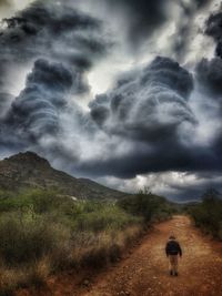 Scenic view of landscape against cloudy sky