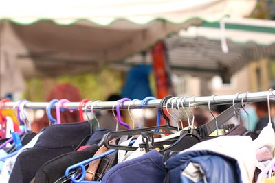 Close-up of clothes hanging on rack