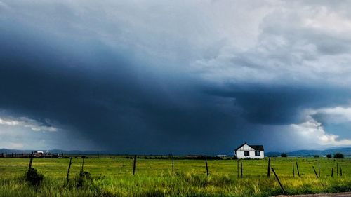 House on field against sky