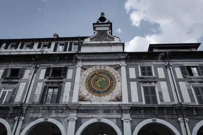 Low angle view of clock tower against sky