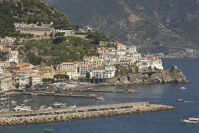 High angle view of townscape by sea