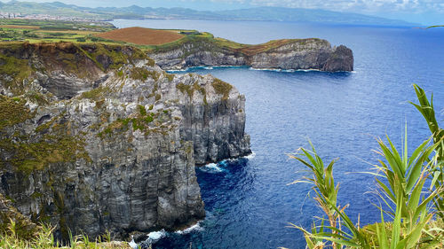 High angle view of rocks by sea