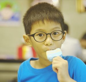 Close-up portrait of boy holding ice cream