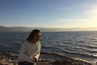 Woman on beach at sunset