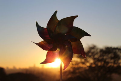 Close-up of sun against clear sky during sunset