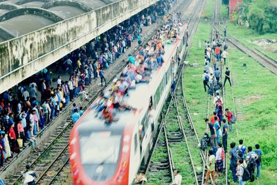 High angle view of people on railroad tracks