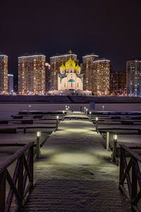 Illuminated city buildings at night