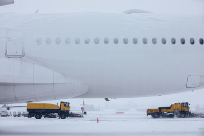 Winter frosty day at airport during heavy snowfall. 