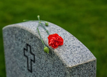 Close-up of cross on cemetery