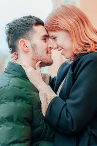 Side view of couple kissing