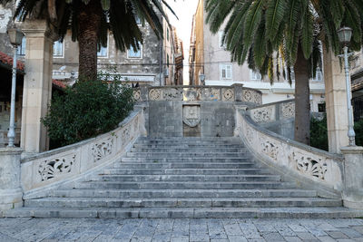 Staircase leading towards temple against building