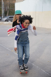 Two young women skating