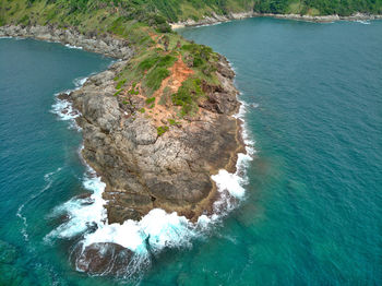 High angle view of rocks in sea