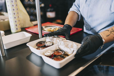 High angle view of man preparing food in restaurant