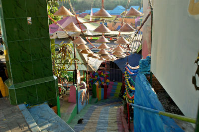 Clothes drying on railing by building