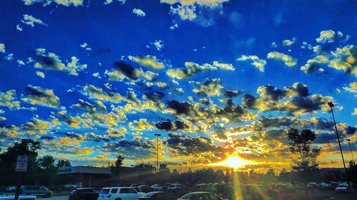 Cars on road at sunset