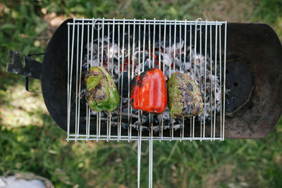 Close-up of bell peppers roasting on barbecue grill