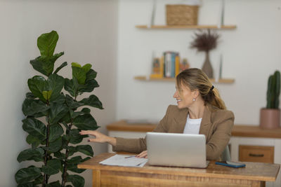 Woman working at home with laptop. home office.  notebook for working. 